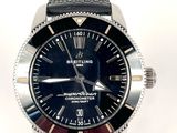 a close up of a wrist watch on a white surface