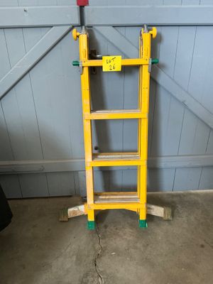 a yellow ladder that is leaning against the wall