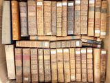 a box full of old books sitting on a table