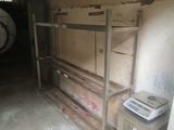 a stack of boxes and a scale in a room