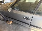 a car that is parked in a garage with the door open