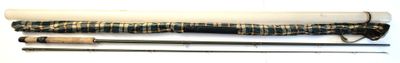 two different types of fishing rods on a white surface