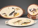 three plates with different designs on them sitting next to each other