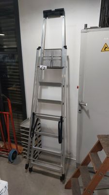 a ladder that is leaning against a wall in a room