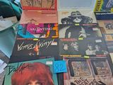 a table with a lot of records and cds on it
