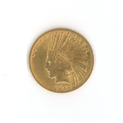 une pièce d'or représentant une tête d'Indien sur un fond blanc