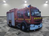 a red fire truck that is on a checkered floor