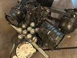 a pile of wires and a clock sitting on the floor