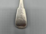 a silver spoon with a silver handle on it