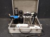 a silver case with a bunch of items inside of it