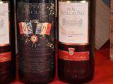 three bottles of wine that are sitting on a table