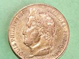 a close up of a coin on a green surface