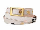 the belt is white and has a gold buckle on it