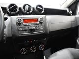 a dashboard of a car with a radio and a steering wheel