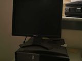 a desktop computer sitting on top of a desk next to a keyboard and mouse