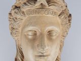 statue of a woman ' s head with a crown on her head