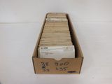 a box full of mail sitting on a white surface