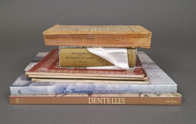 several books stacked on top of each other on a table
