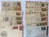 three old envelopes with stamps on them sitting on a table