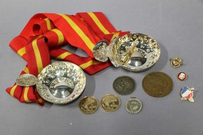 a medal, a medal, and a medal on a table