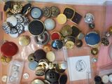 a lot of buttons and buttons on the table