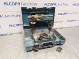 a tool box with a drill and a cord in it