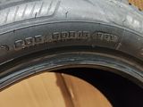 tire tread of a car on a cardboard box with cardboard boxes in the background