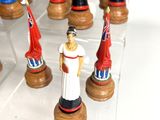 a lot of figurines that are on display in a glass case