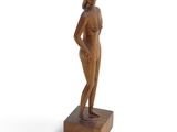 an image of a wooden statue of a woman on a white background