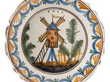 a decorative plate with a windmill on it