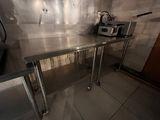 a stainless steel counter with a toaster and toaster on it