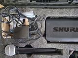 two microphones in a case on a table