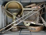 a basket full of old tools and utensils in it