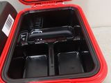 a red case with a handle and two trays in it