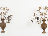 two wall sconces that are attached to the wall