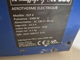 the back of a blue electric box with a label on it
