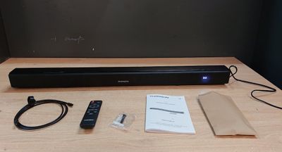 a remote, a remote control, and a box on a table