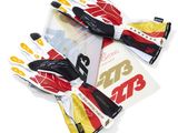 three pairs of gloves with yellow and red designs on them