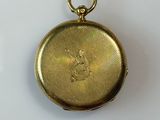 an image of a gold locke with a picture of a woman on it