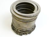 a close up of a metal object on a white surface