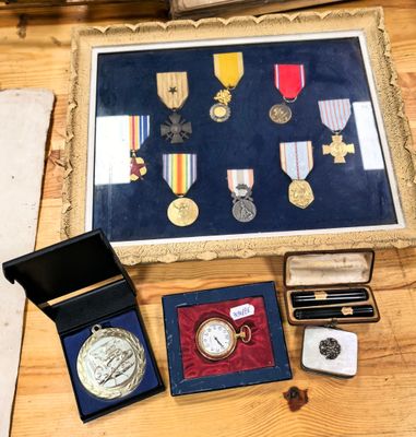 a picture of a collection of medals and other items on a table
