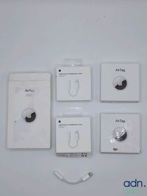 four white boxes with ear buds and earplugs on them