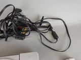 a video game console and a game controller sitting on a table