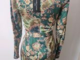 the back of a dress with a floral pattern on it
