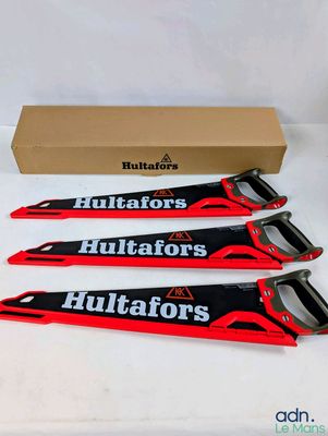 three red and black blades with a box on a white surface