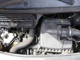 a close up of a car ' s engine with its hood open