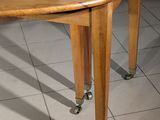 an image of a wooden table with wheels on it