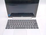 a laptop computer sitting on top of a white table