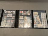 a lot of different stamps on a table together