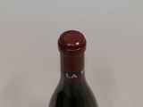 a bottle of wine that is sitting on a table